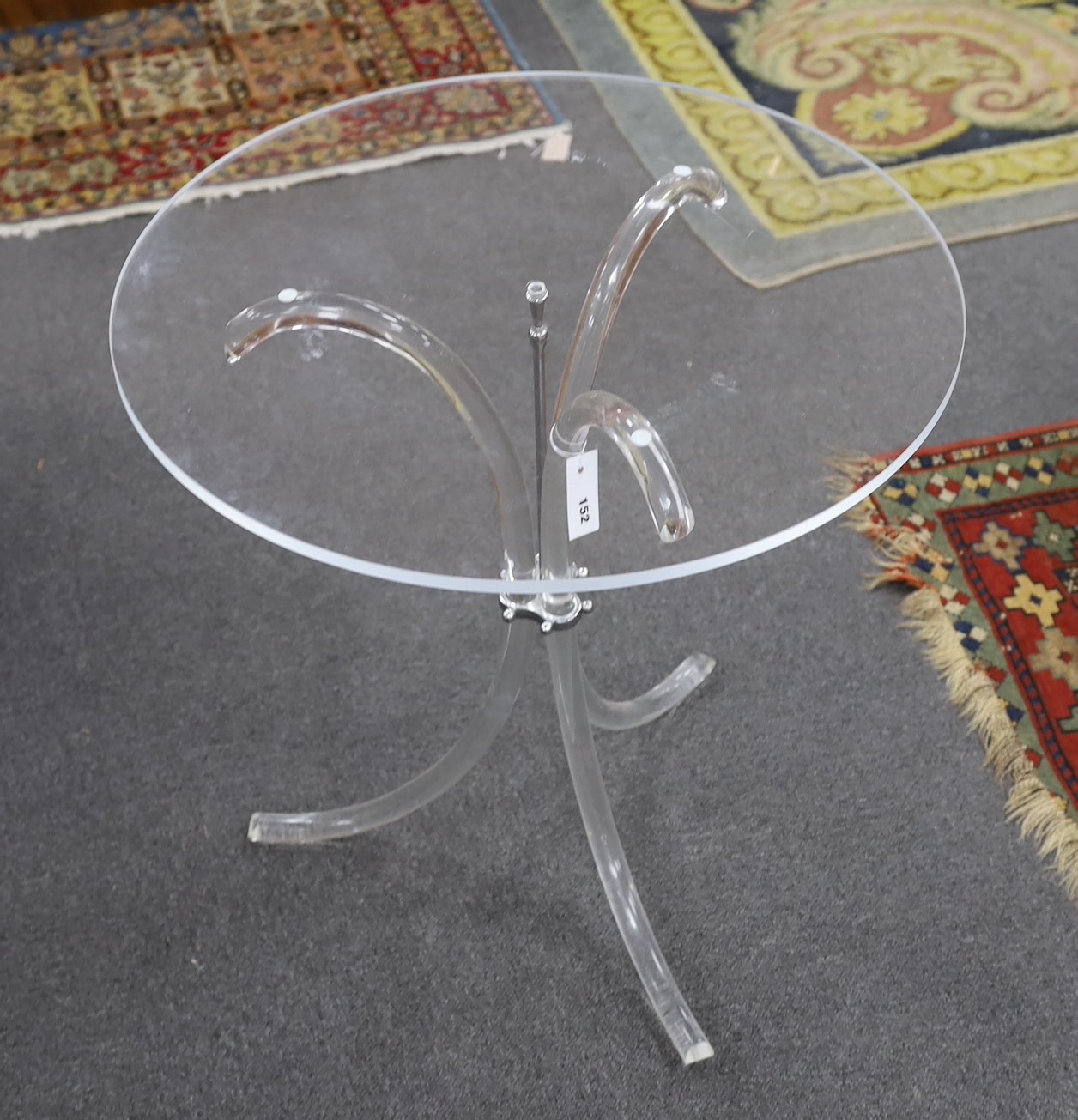 A Charles Hollis Jones style circular lucite tripod table, diameter 67cm, height 69cm